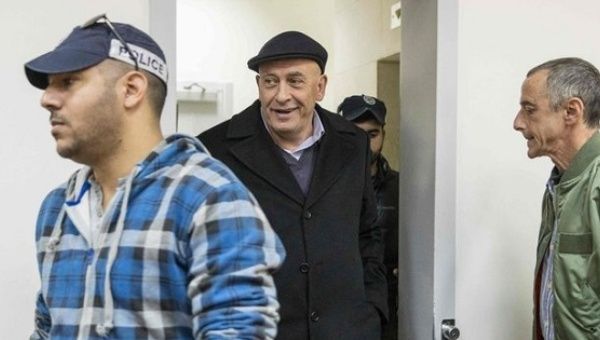 Israeli Knesset member Basel Ghattas (C) arrives at the Magistrates Court in Rishon Lezion, Israel Dec. 23, 2016.