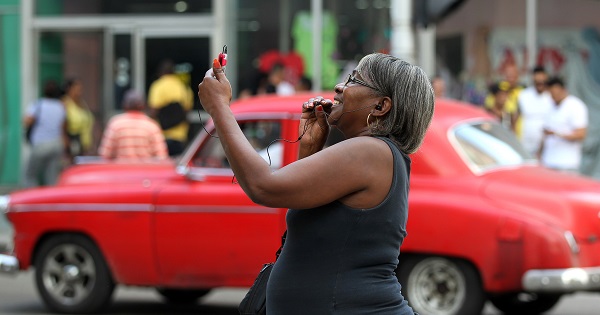 A woman makes a call from a Wi-Fi zone in Havana, Cuba, Feb. 4, 2016.