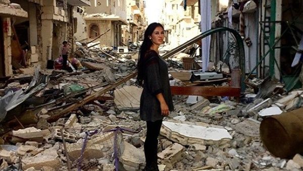 Carla Ortiz stands in war-torn Syria during filming of her upcoming documentary.