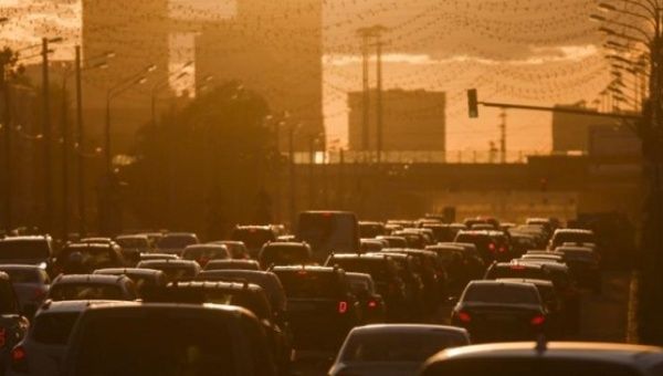 Cars are stuck in a traffic jam during sunset in Moscow, Russia, June 4, 2015. 