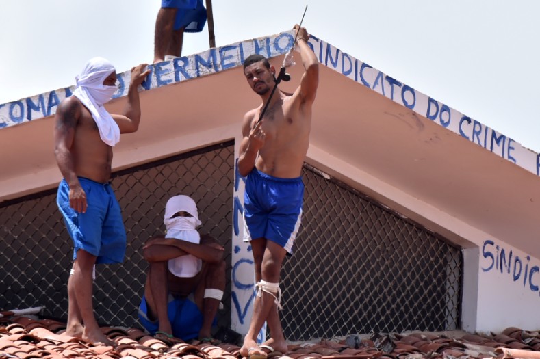 Inmates are seen on a roof during an uprising at Alcacuz prison in Natal.