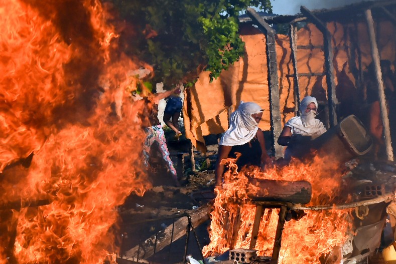 The overcrowded prisons are now the battleground in a quickly escalating war between the nation's two biggest drug gangs, the Sao Paulo-based First Capital Command and the Red Command based in Rio de Janeiro.