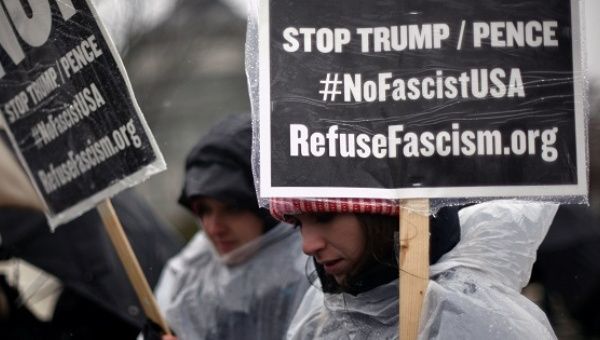 Women participate in a protest organized by RefuseFascism.org outside the U.S. Supreme Court against U.S. President Trump in Washington, D.C.