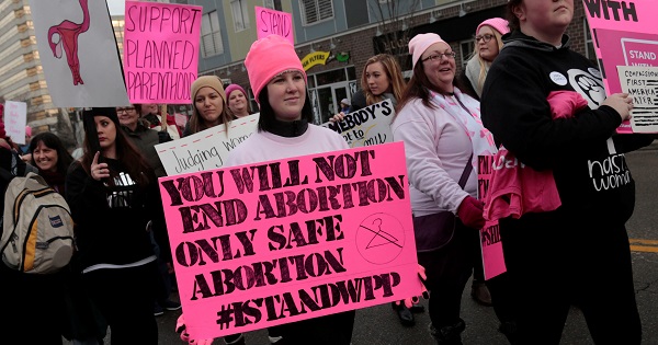 Pro-choice demonstrators rally outside a Planned Parenthood clinic in Detroit, Michigan, Feb. 11, 2017.