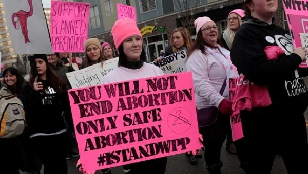 Pro-choice demonstrators rally outside a Planned Parenthood clinic in Detroit, Michigan, Feb. 11, 2017.