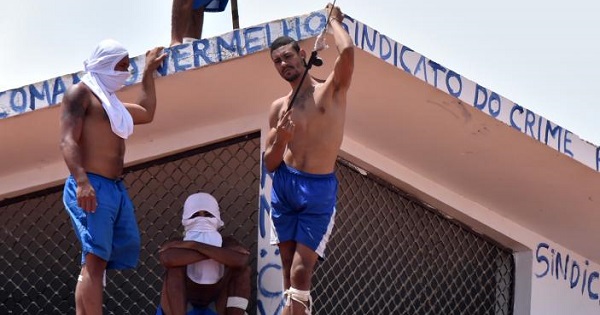 Inmates are seen on a roof during an uprising at Alcacuz prison in Natal, Rio Grande do Norte state, Brazil.