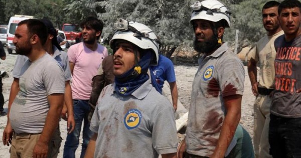 Members of Syria's White Helmets after double airstrikes on the rebel-held Bab al-Nairab neighborhood of Aleppo, Syria, Aug. 27, 2016.