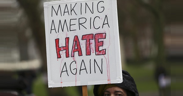 A demonstrator marches against U.S. President Donald Trump during a protest in London, Britain, Feb. 4, 2017.