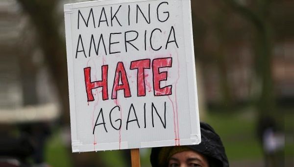 A demonstrator marches against U.S. President Donald Trump during a protest in London, Britain, Feb. 4, 2017.