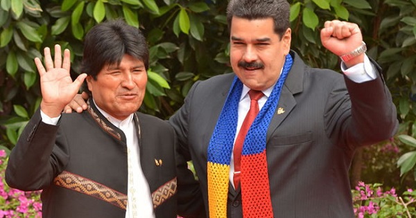 Bolivian President Evo Morales (L) gestures alongside his Venezuelan counterpart President Nicolas Maduro.