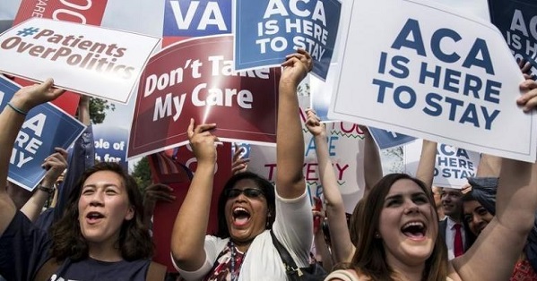 Supporters of the Obamacare celebrate after the Supreme Court upheld the law in the 6-3 vote in Washington, D.C.