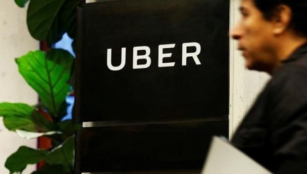 A man exits the Uber offices in Queens, New York.