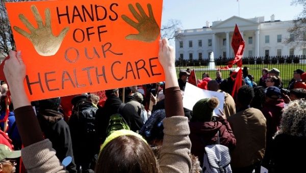 Protesters demonstrate against U.S. President Donald Trump and his plans to end Obamacare outside the White House in Washington, U.S., March 23, 2017.