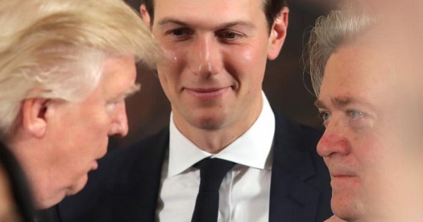 U.S. President Donald Trump talks to senior staff Steve Bannon and Jared Kushner at the White House in Washington, D.C.