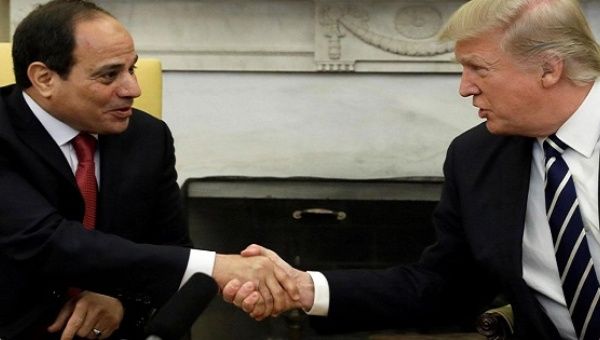 U.S. President Donald Trump shakes hands with Egyptian President Abdel Fattah el-Sissi in the Oval Office of the White House.