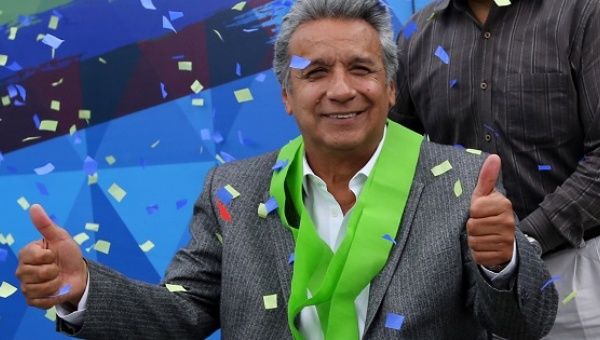 Ecuadorean leftist Lenin Moreno celebrates after the country's electoral council said he won Sunday's presidential election, at his party headquarters in Quito.