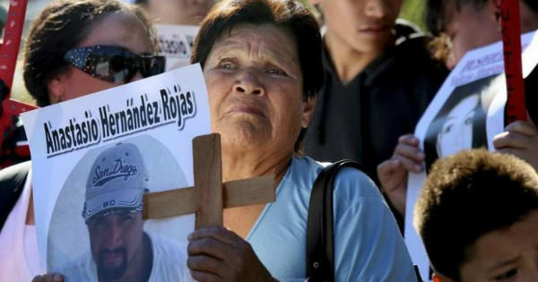 Protesters show support for victims killed by Border Patrol agents during a rally in the U.S.