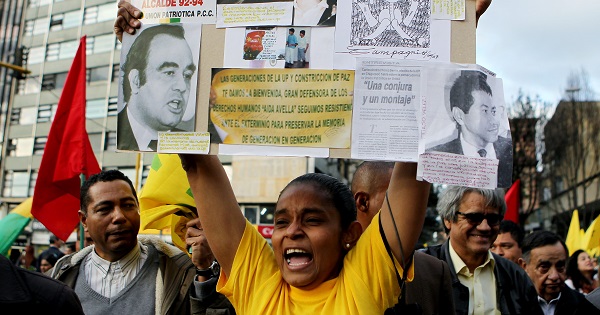 Demonstrators remember victims of political violence in Colombia.