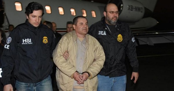Mexico's top drug lord Joaquin ''El Chapo'' Guzman is escorted as he arrives at Long Island MacArthur airport in New York, U.S., Jan. 19, 2017.