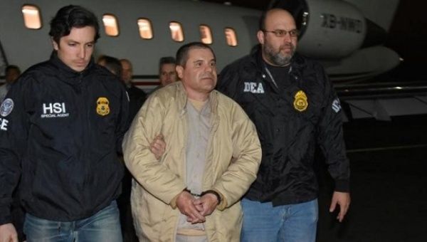 Mexico's top drug lord Joaquin ''El Chapo'' Guzman is escorted as he arrives at Long Island MacArthur airport in New York, U.S., Jan. 19, 2017.