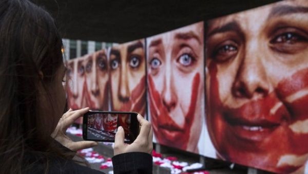 NGO Rio de Paz shows pictures of models representing women victims of sexual attacks in Sao Paulo, Brazil, on June 10, 2016.