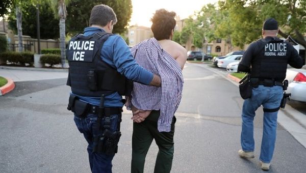 A ICE official arrests an Iranian immigrant in San Clemente, California, on May 11, 2017. 