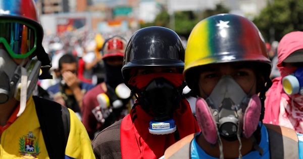 Right-wing demonstrators wearing gas masks take part in a protests in Caracas, Venezuela, May 29, 2017.