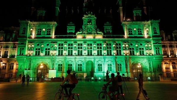 Green lights are projected onto the facade of the Hotel de Ville in Paris, France, after U.S. President Donald Trump announced his decision  June 1, 2017.