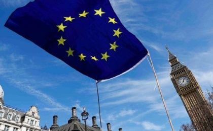 An EU flag flies above Parliament Square during a Unite for Europe march, in London, Britain, on March 25, 2017.