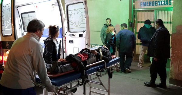 A injured man is carried into the emergency room at Schestakow Hospital in San Rafael, Argentina.