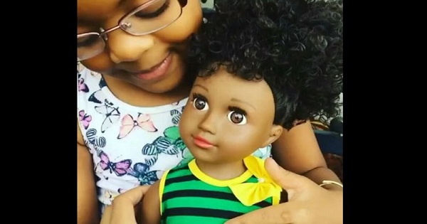 Young girl with the Toya doll.