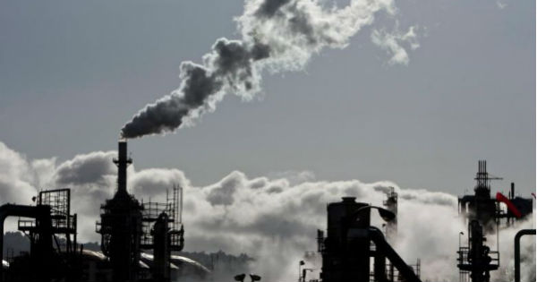 Smoke is released into the sky at a refinery in Wilmington, California.