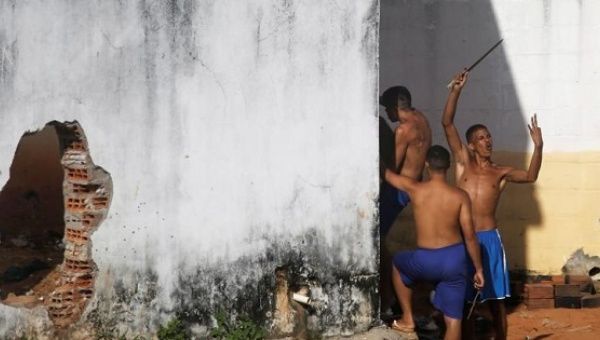 Nearly 60 killed in Brazil prison riot while dozens of inmates escape