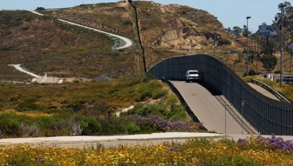 U.S. border patrol agents at the fence with Mexico at Border Field State Park in San Diego, California.