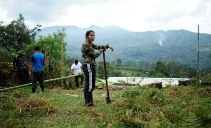 FARC members help build peace camp facilities near the transitional zone of Pueblo Nuevo in the Cauca mountains of Colombia.