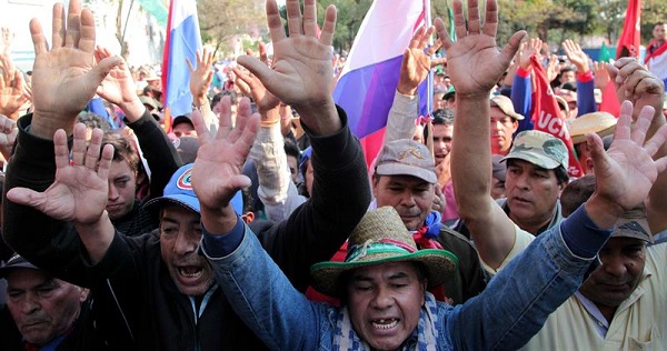 Campesinos protest Wednesday in Asuncion for the fifth week.