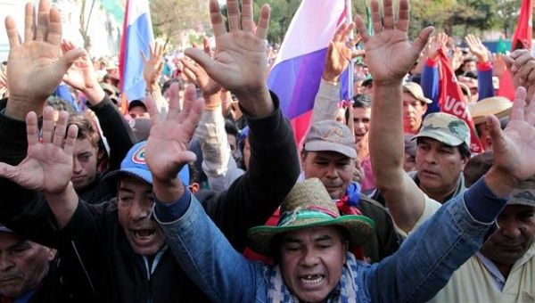 Campesinos protest Wednesday in Asuncion for the fifth week.