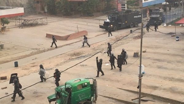 Esmad police clash with miners during a protest in Segovia, Antioquia