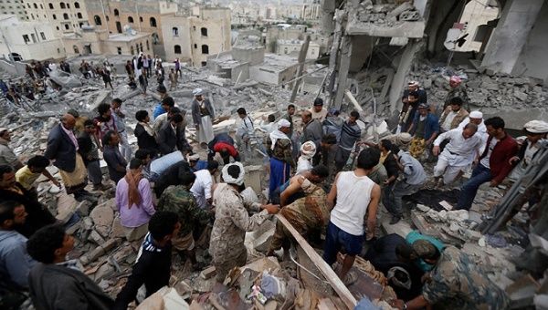 Local residents search through rubble following airstrikes that destroyed houses and killed at least a dozen in Sanaa, Yemen August 25, 2017.