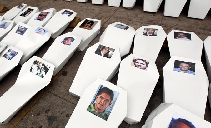 Paper coffins, symbolizing slain journalists, are seen lined up during a protest to demand justice for them in Tegucigalpa, Honduras, on April 11, 2016.