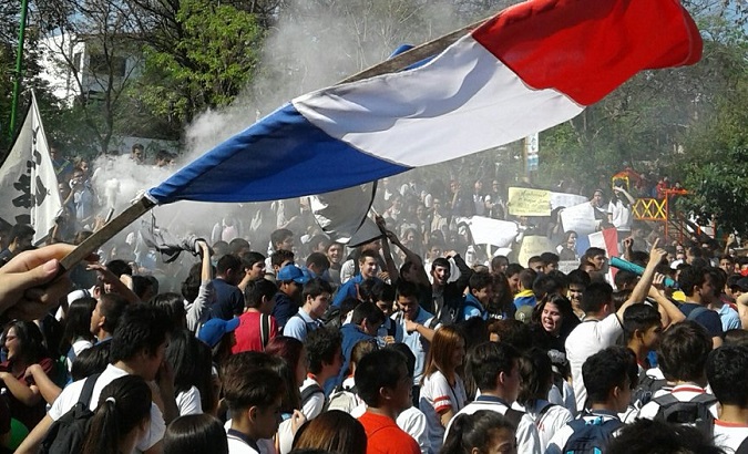 Students and teachers take part in street protests.