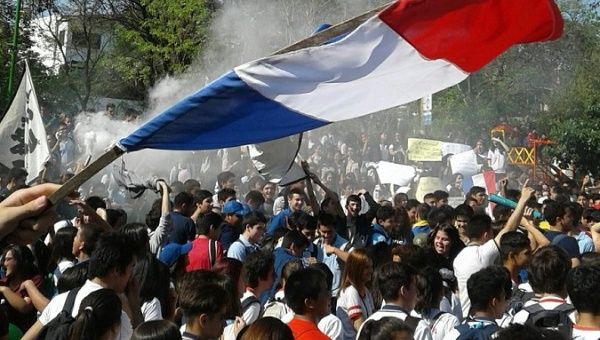 Students and teachers take part in street protests.