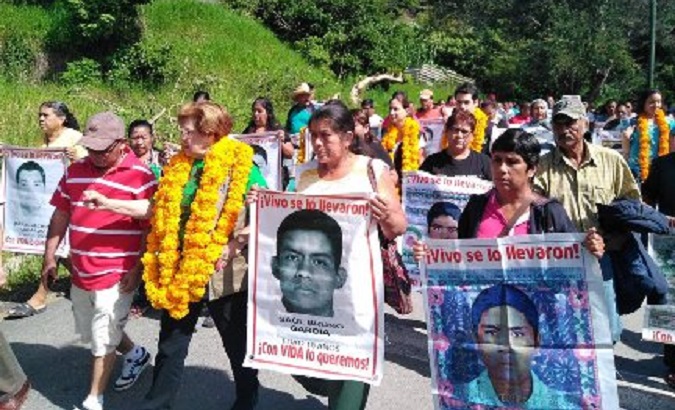 Families of the 43 students march in Mexico.