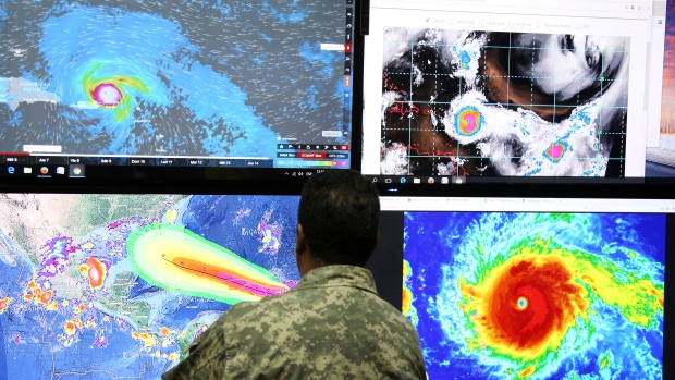 A member of the Emergency Operations Committee monitors the trajectory of Hurricane Irma in Santo Domingo, Dominican Republic, on Tuesday