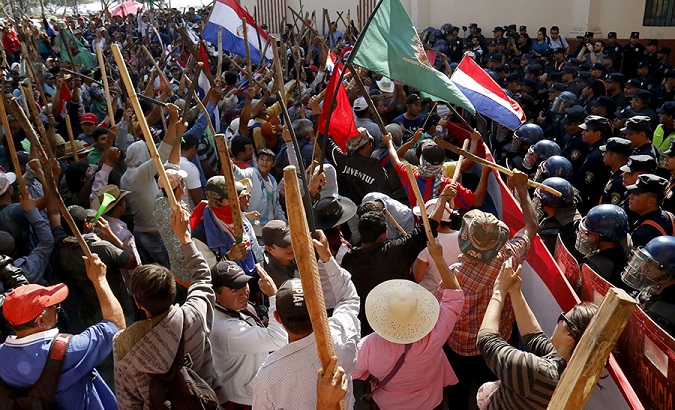 Paraguay's police clashed with campesinos in the capital Asuncion.