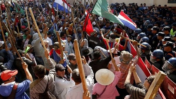 Paraguay's police clashed with campesinos in the capital Asuncion.