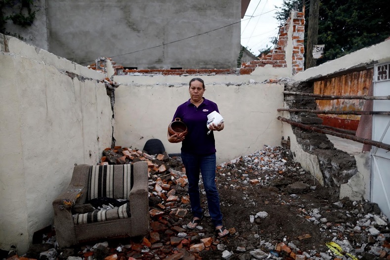Now living with relatives, this woman and many others hope their destroyed homes will eventually be rebuilt.