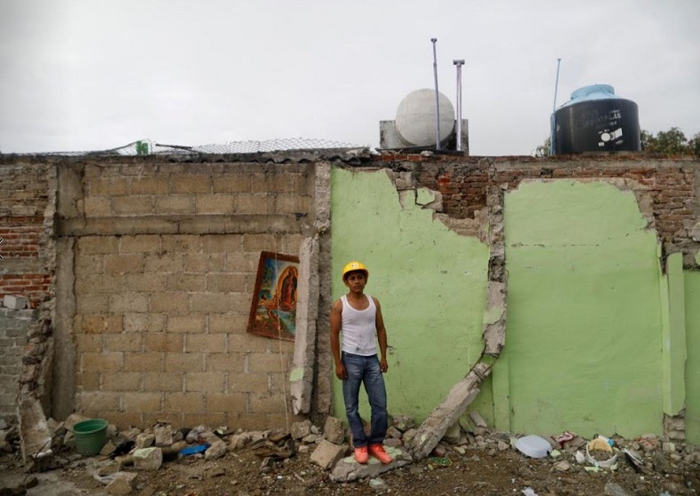 Jaime Delgado, 21, an agricultural worker whose house was not damaged, said: “A lady died here, crushed by the rubble. All this is over, now I search pieces of iron to sell. My economic situation is bad.”