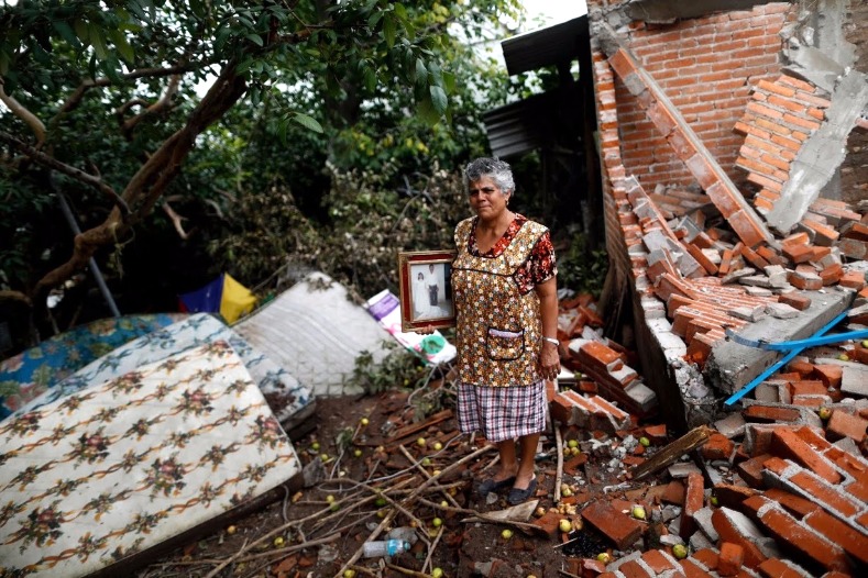 70-year-old housewife Maria Guzman's house in San Jose Platanar in Puebla state was left completely uninhabitable. Forced to live in a shelter, she said 