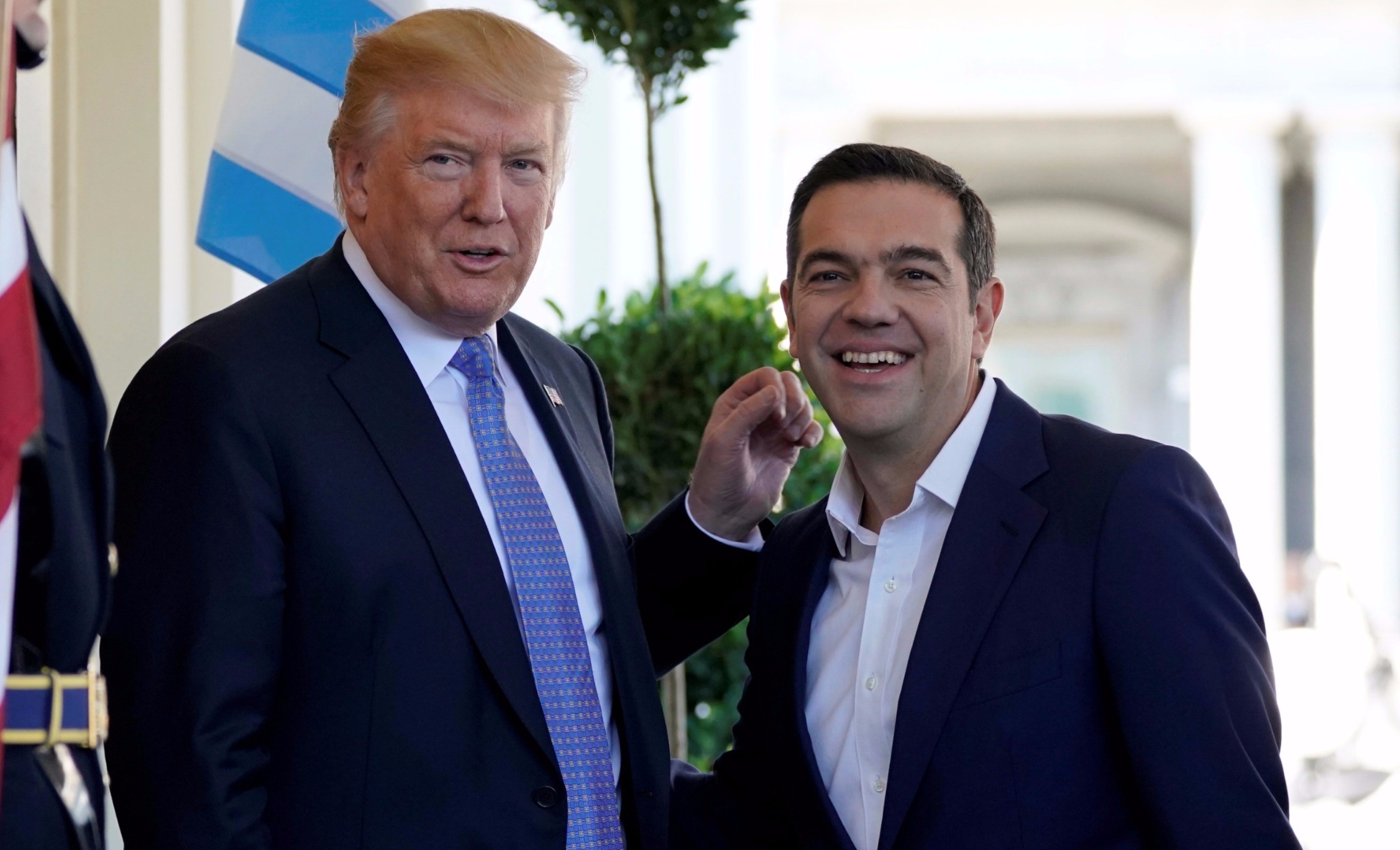 U.S. President Donald Trump greets Greek Prime Minister Alexis Tsipras as he arrives at the White House in Washington, U.S., Oct. 17, 2017.